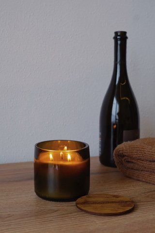 Spicy candle in a wide wine bottle, dark, fragrance #4